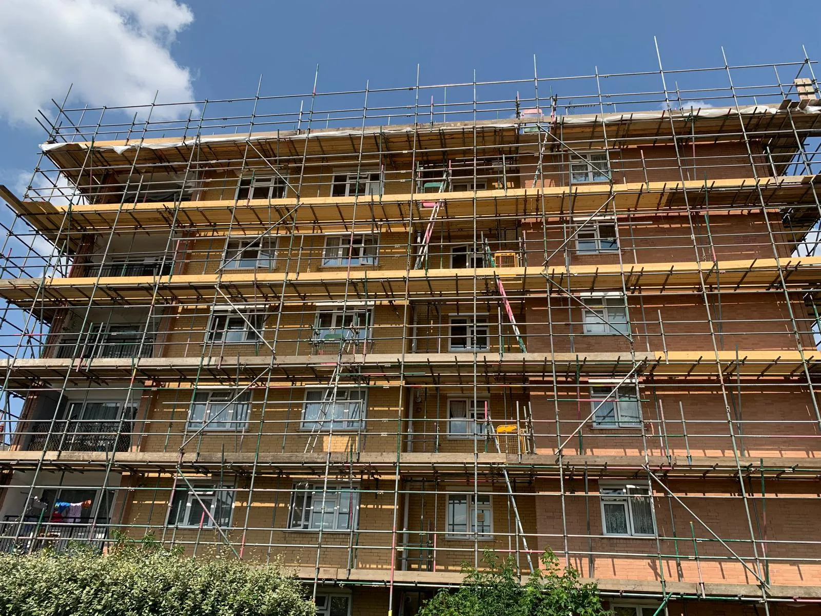 Scaffolding erected across an apartment building for external works