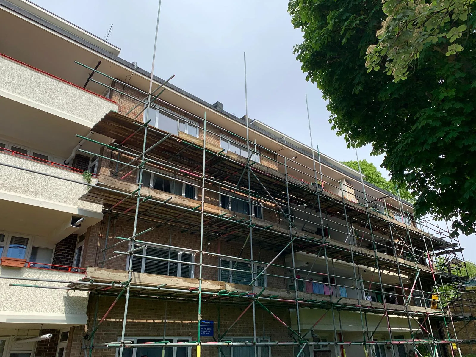 Commercial scaffolding providing access across a residential block